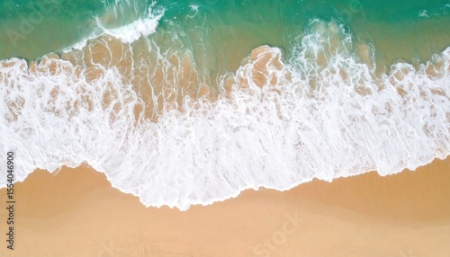 Aerial View Of Sandy Beach With Turquoise Water And Foamy Waves