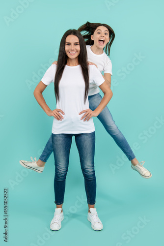 Jump of mother and daughter. Energy and motion. Mother and daughter jump high. Excited happy jumps of family girls. Fun mother and daughter. Jump motion. Family jump mother and daughter.