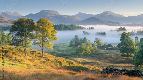 Picturesque morning landscape with fog rolling through Scottish Highlands