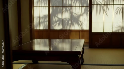 Quaint interior of a traditional Japanese room featuring warm wooden tones and delicate bamboo shadows
