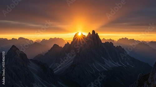 Majestic sunrise over rugged mountain peaks with vibrant colors