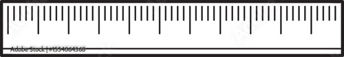 High-contrast monochrome ruler graphic with fine markings.