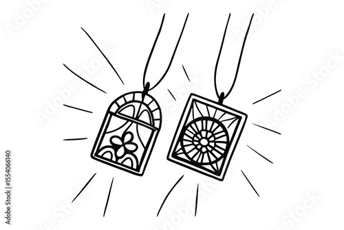 Delicate hand drawn pendants necklaces with intricate design details and radiating lines isolated on white backdrop