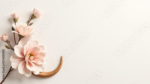 Elegant Floral Arrangement with a Curving Wooden Element on a White Background