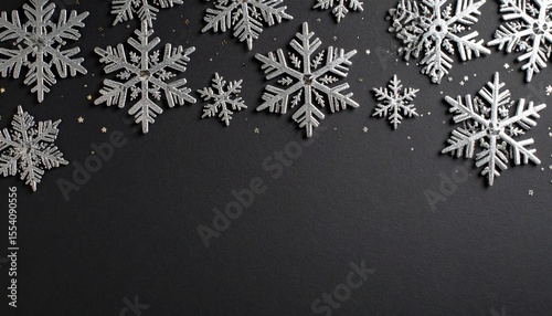 Sparkling Silver Snowflakes Scatter Across a Dark Textured Background Creating a Festive Winter Scene