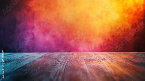 A wooden table with a colorful background featuring a gradient of warm colors.