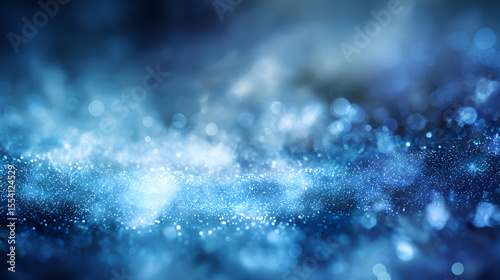 Blue and white bokeh dots creating a hazy textured effect with varying light intensity