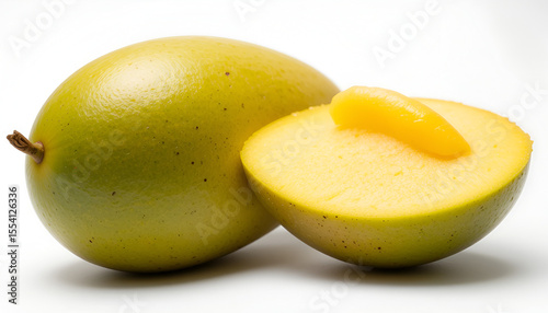 Ripe yellow mango fruit, with a juicy cut half revealing vibrant golden flesh, offers a delicious and healthy tropical treat.