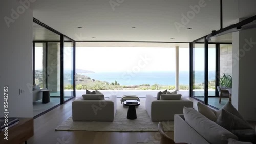 Expansive modern living room with panoramic ocean views and contemporary design, perfect for indoor-outdoor luxury.