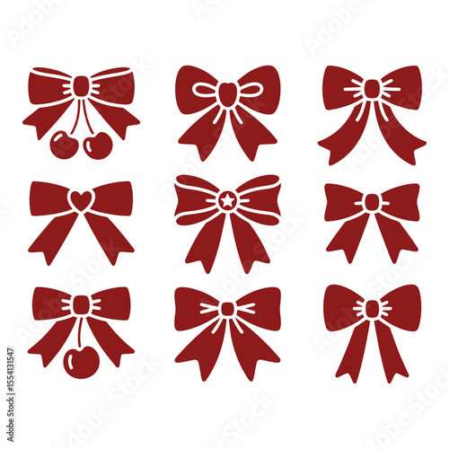 Collection of decorative bows and ribbons on a light pink background