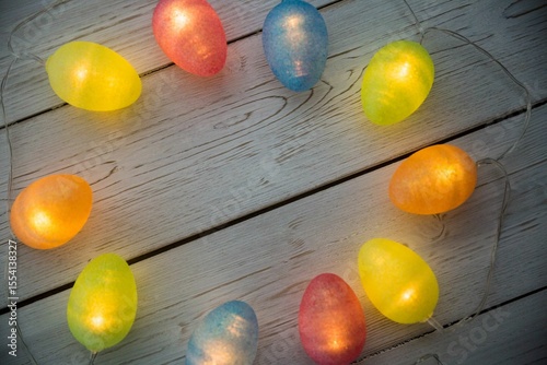 Illuminated lights on wooden planks