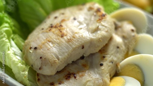 Grilled chicken salad with bananas and vegetable salad. Grilled chicken breast, fillet and fresh vegetable salad of lettuce. Healthy lunch menu. Diet food.