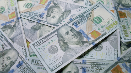 A closeup view of stacks of U.S. Hundred Dollar Bills arranged neatly and attractively