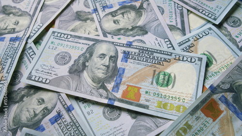 A Stack of U.S. Dollar Bills That Are Neatly Piled Together in an Organized Manner