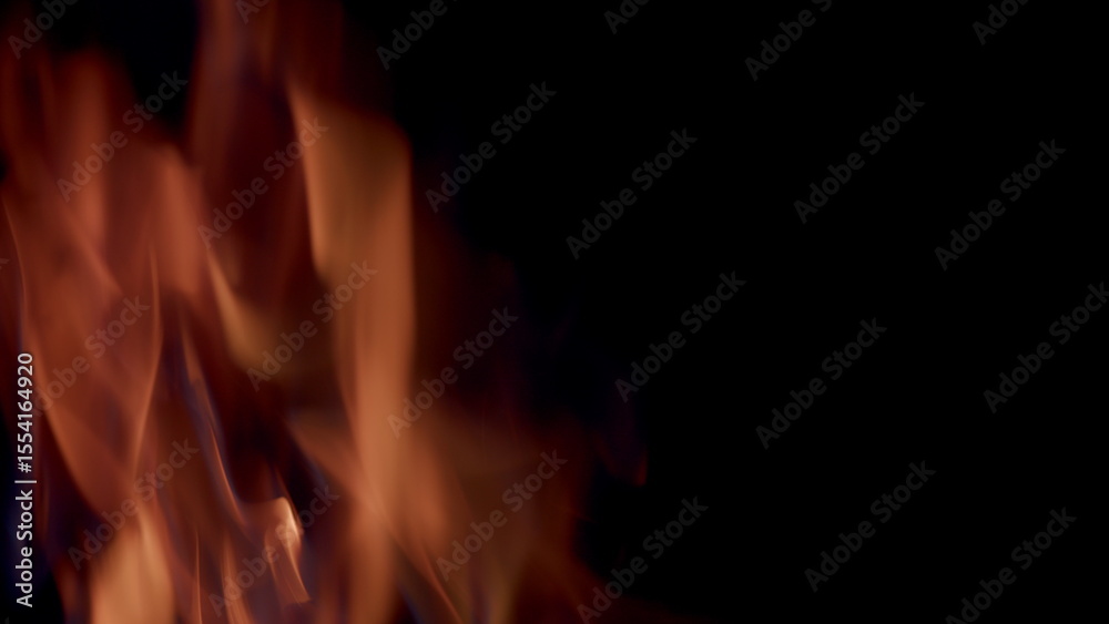 The mesmerizing flames gracefully dance in the darkness, creating a captivating atmosphere The mesmerizing flames gracefully dance in the darkness, creating a captivating atmosphere