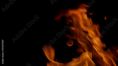 Dynamic Flames Dancing Gracefully in the Darkness of the Night, Captivating Beauty and Light