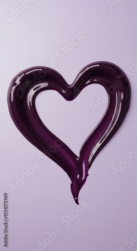 A dark purple, creamy lipstick is smeared into the shape of a heart on a light purple background. A cosmetic texture concept for a beauty product advertisement. A makeup product sample swatch for lip