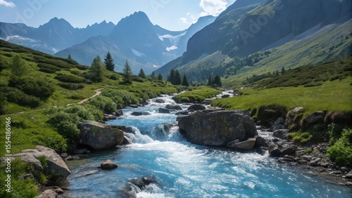 A vibrant river flows through a lush green valley with mountains in the distant background view landscape photo