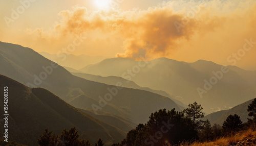 Wildfire smoke rising in mountainous region at sunrise, nature's power