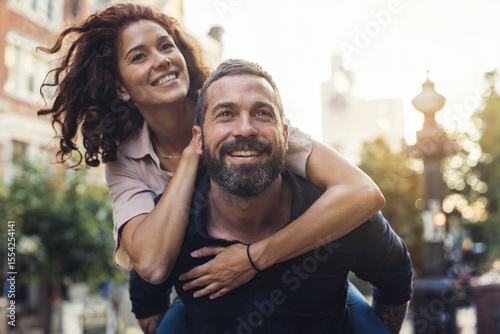 Happy and in love with each other man and woman. Focus on the man's face.
