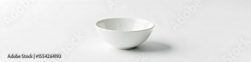 Close-up shot of an empty bowl on a pristine white background, symbolizing the powerful concept of hunger and its stark reality , desperation, gastric, empty space