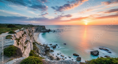Spectacular Coastal Cliffside Overlooking a Turquoise Ocean During Golden Hour Sunset