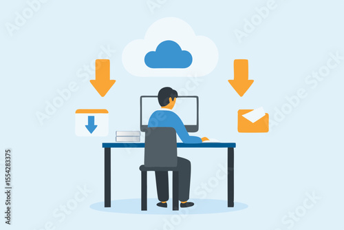 Man working at desk with computer downloading data from cloud storage