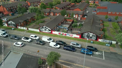 Advancing and descending aerial video of the politcal murals at 'Freedom Corner' on the Newtownards Road in East Belfast, Northern ireland. Filmed in 4K, 60FPS and with Rec709 color.