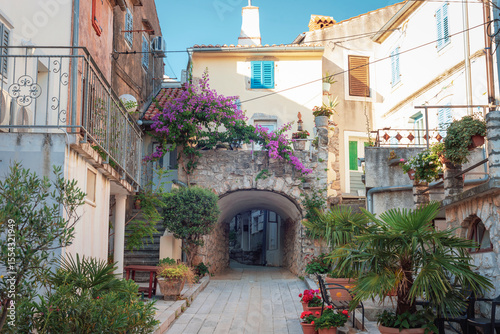Fototapeta Naklejka Na Ścianę i Meble -  Street in Omisalj, a small town located on Krk island, Croatia