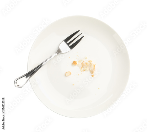 Dirty plate with bread crumbs and fork isolated on white, top view
