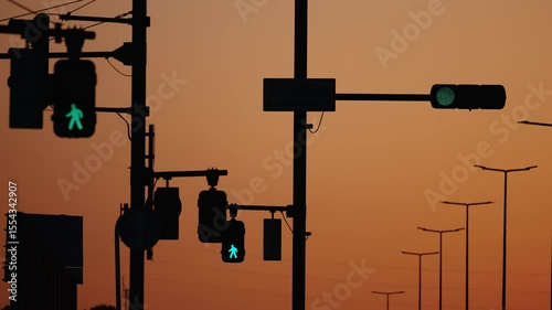 Modern streetlights and crossing signals creating a dramatic twilight scene.