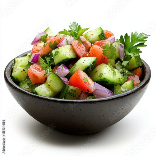 Fresh Vegetable Salad with Cucumber, Tomato, and Red Onion in Dark Bowl