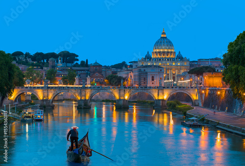 St Peter Cathedral at twilight blue hour - Gondolier punting gondola through canal waters at night - Rome, Italy