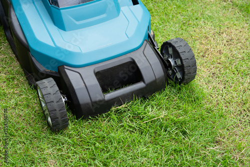Lawn mover machine cut green grass, Hobby planting home garden.