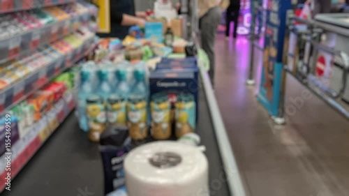 Ribbon with goods in a store in front of the checkout, paying for goods in a supermarket