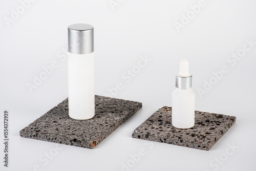 Plastic white tube for cream or lotion. Skin care or sunscreen cosmetic, Cosmetic accessory for makeup with stylish props on white background.