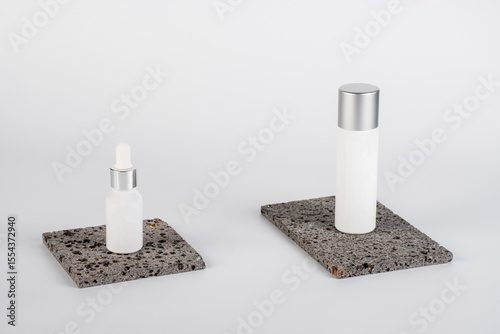 Plastic white tube for cream or lotion. Skin care or sunscreen cosmetic, Cosmetic accessory for makeup with stylish props on white background.