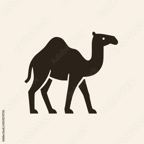 A dark brown camel stands out against a beige backdrop in a minimalist design