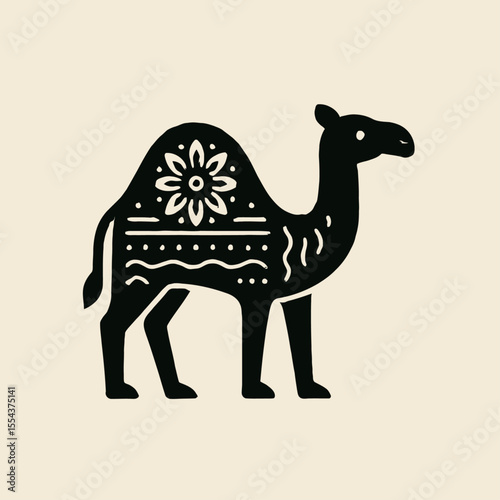 A black decorative camel with patterns stands out against a beige background