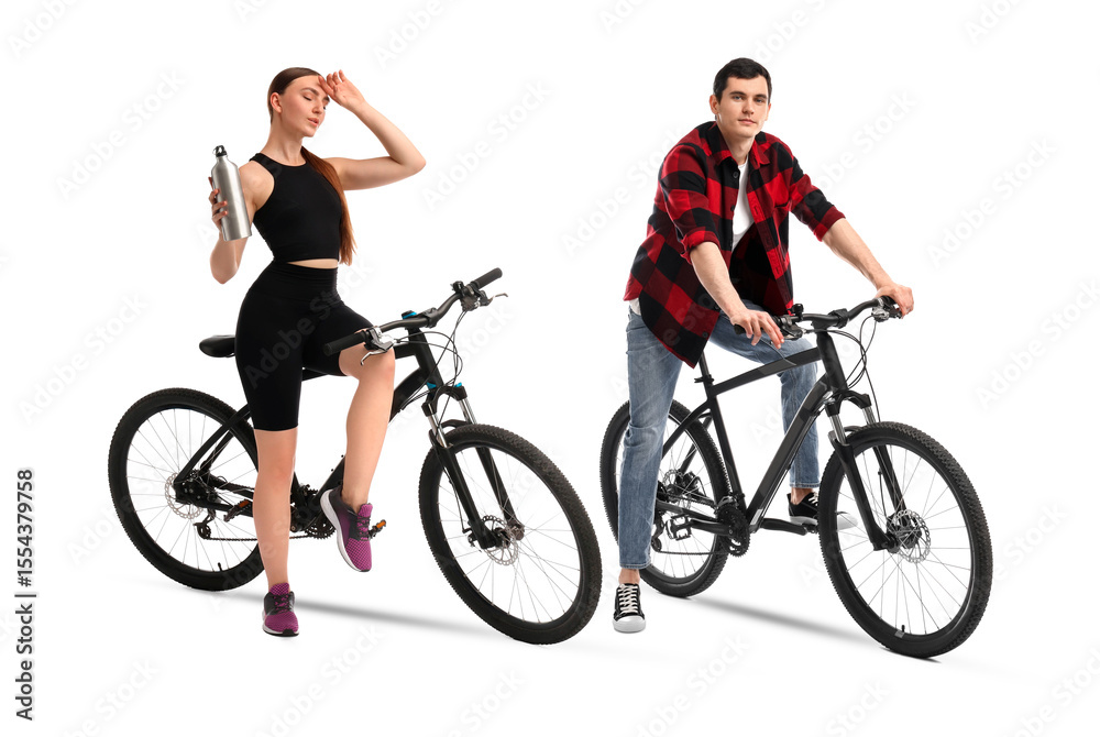 Fototapeta premium Young man and woman with bicycles on white background