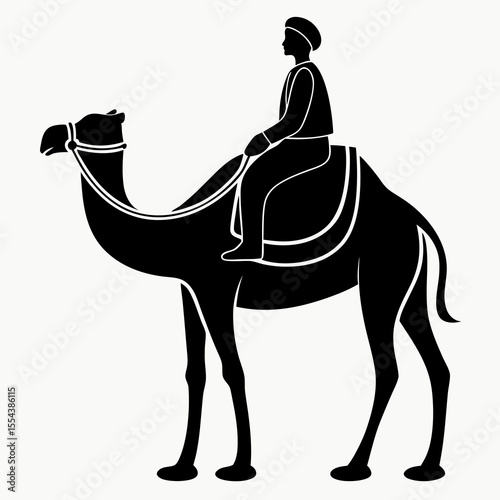 Silhouette of a person riding a camel with a saddle and bridle