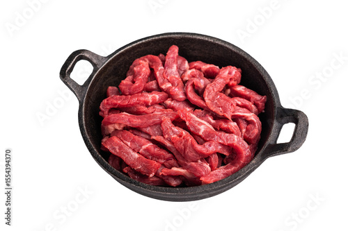 Raw beef meat sliced strips for beef stroganoff isolated on white background