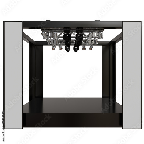 minimalist stage setup.  It features a rectangular enclosure with tall, slim side panels, a suspended lighting rig, and a dark background. The scene is clean and focused on the empty stage space