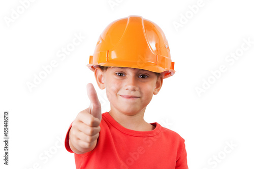 Girl in a protective construction helmet shows that everything is fine.