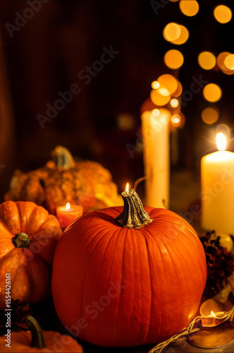 Autumn banner of pumpkins and fall decor on a rustic wood background with copy space 