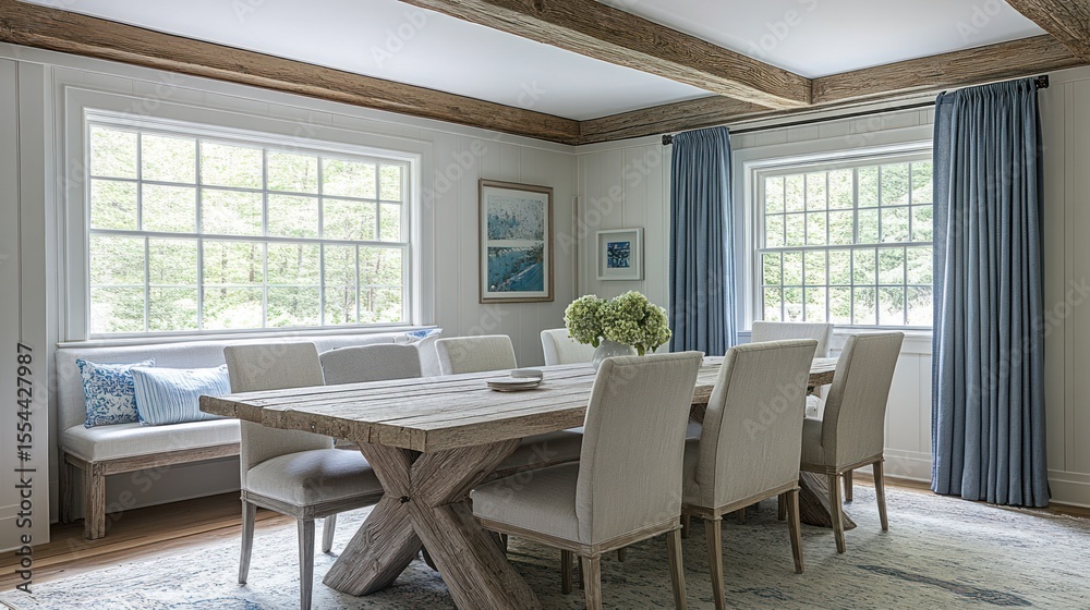Fototapeta premium Rustic dining room with large windows and light blue drapes.