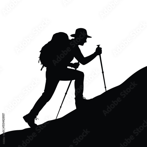 Silhouette of a Hiker Ascending a Hill with Trekking Poles