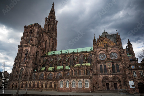 The gigantic Strasbourg cathedral looming up into a moody sky