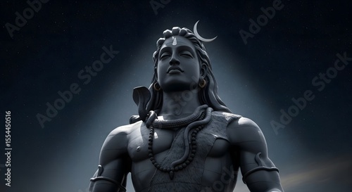 Lord Shiva Statue: A stone statue of the Hindu god Shiva, adorned with a crescent moon and a serpent, stands majestically against the sky in a artistic display of faith and divine power.