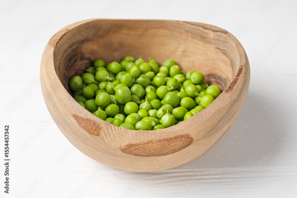 Fresh ripe green peas on white wooden table, closeup Fresh ripe green peas on white wooden table, closeup